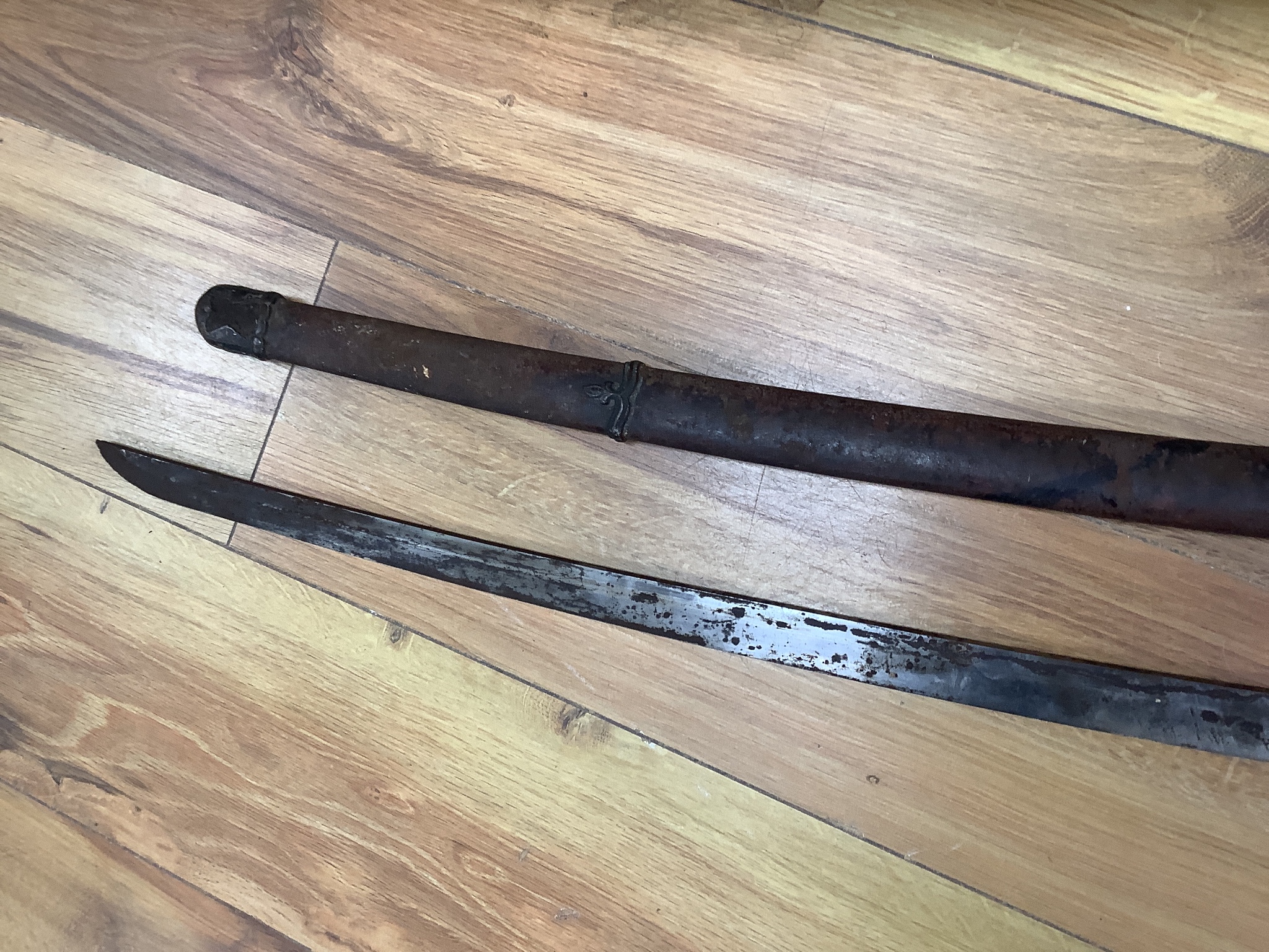 A Japanese Type 94 military sword lacking tsuba and hilt. Signed tang. 90cm excl scabbard